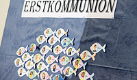 Erstkommunionskinder der Dompfarre St. Martin. Die Bildsprache vom reichen Fischfang prägt das Lebensgefühl der christlichen Gemeinde bis heute.  